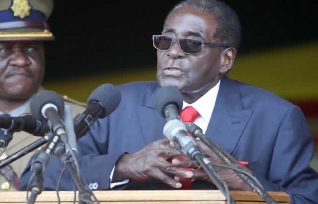 Mugabe defies demands to quit as Zimbabwe’s leader after party fires him