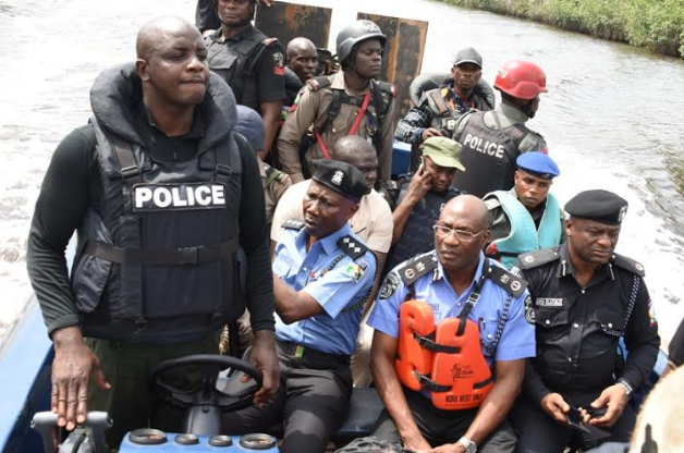Caption Operatives of the Lagos Police command led by the commissioner of Police Fatai Owoseni and Commander Rapid Response squad, RRS,  ACP  Tunji Disu navigating through the  Isawo creek Yesterday.