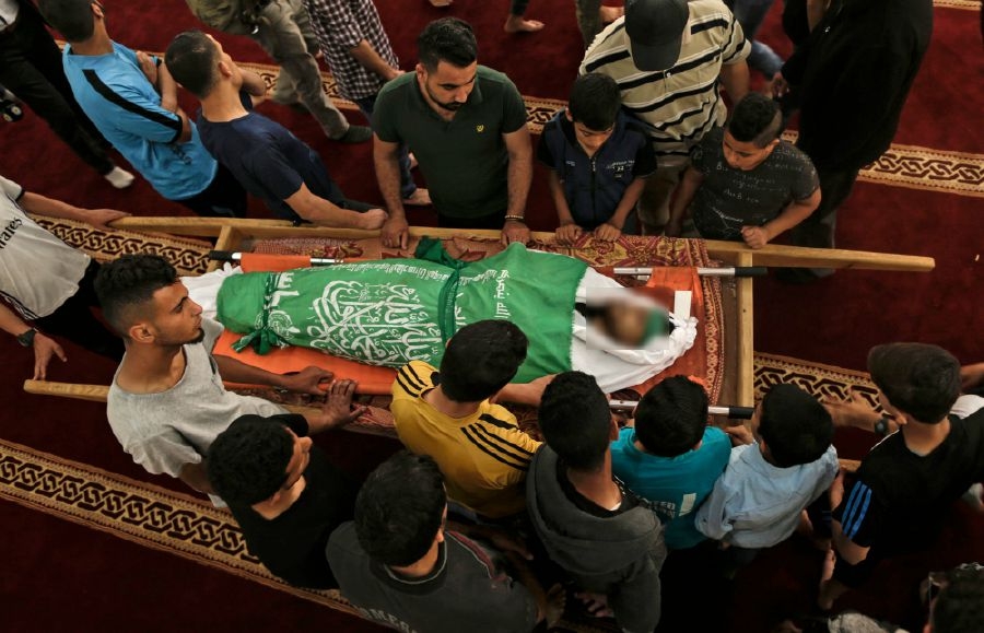 Palestinians bury dead after bloodiest day of Israel border protests