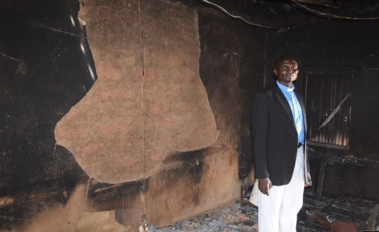 The Protocol Officer (PRO) of the Church of Christ in Nigeria (COCIN), Regional Church Council, RCC, Gashish, Rev. Dyelman Davwar, inside his burnt apartment in the church premises.