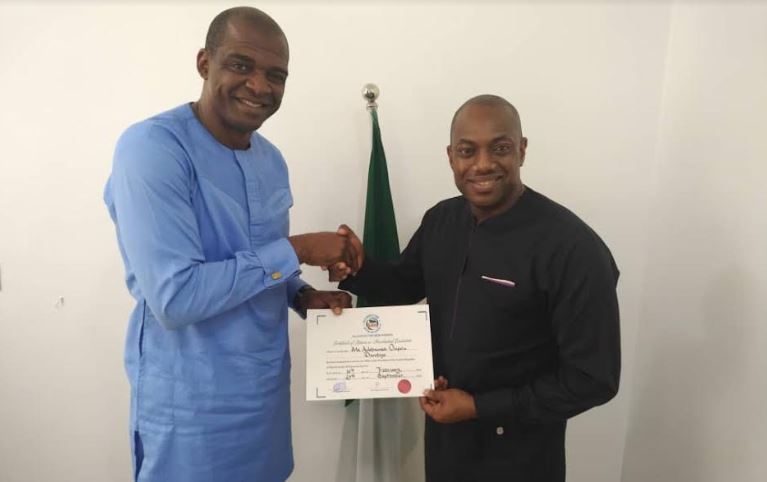 Fela Durotoye [right] receiving Certificate of Return as Presidential Candidate from ANN Party Chairman, Mr. Emmanuel Dania