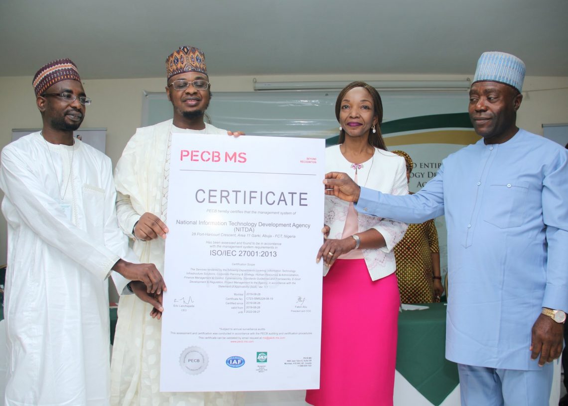 Presentation of ISO 27001: 2013 Certificate by Minister of Communications to DG, NITDA