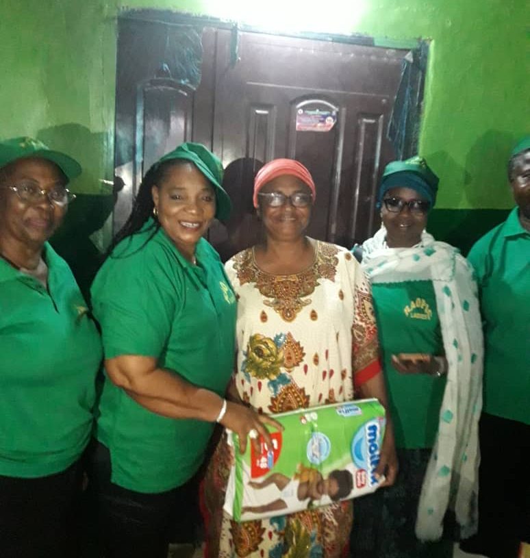 From the left Mrs Folashade Olusanya,  second from the  left the President ( Mrs Kuti Serifat Olubunmi), third to the left : Lady Atinuke Memorial Orphanage home and the Secretary: Alhaja Aminat K. Adetona with all members of Raopic Ladies.