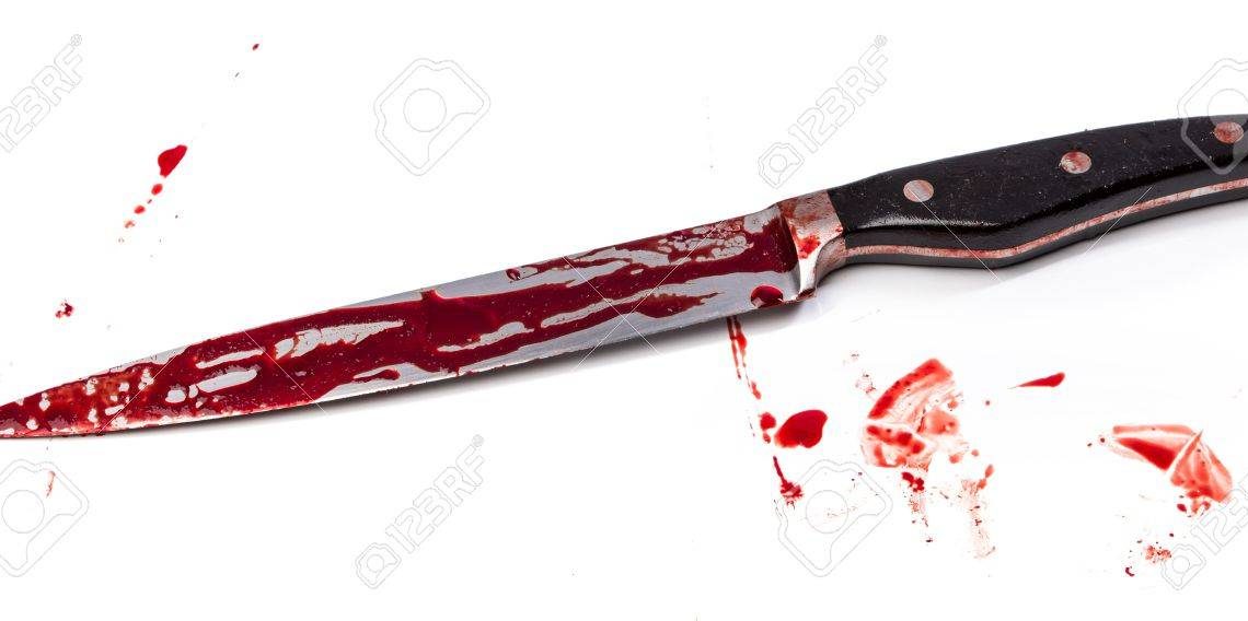 Knife in blood on white background