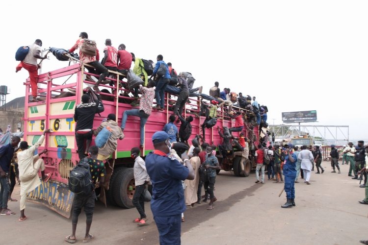 Photos: Police stop trailer load of travelers from entering Lagos