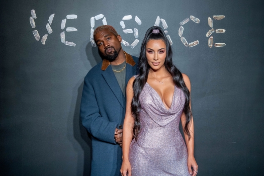 Kanye West and Kim Kardashian West attend the the Versace fall 2019 fashion show at the American Stock Exchange Building in lower Manhattan on December 02, 2018 in New York City. (Photo by Roy Rochlin/Getty Images)