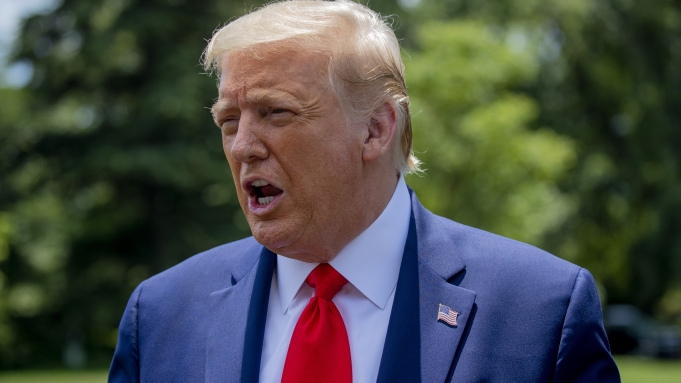 President Donald Trump speaks to members of the press on the South Lawn of the White House in Washington, Wednesday, July 15, 2020, before boarding Marine One for a short trip to Andrews Air Force Base, Md., and then on to Atlanta. (AP Photo/Patrick Semansky)