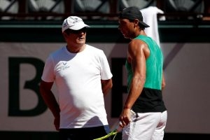 Rafael Nadal of Spain and his coach Toni Nadal during a training session. REUTERS/Benoit Tessier