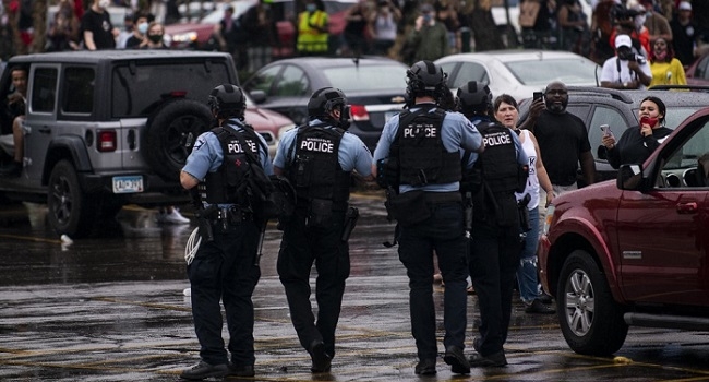 MINNEAPOLIS, MN - MAY 26: Police dressed in tactical gear attempt to disperse crowds gathered to protest the death of George Floyd outside the 3rd Precinct Police Station on May 26, 2020 in Minneapolis, Minnesota. Four Minneapolis police officers have been fired after a video taken by a bystander was posted on social media showing Floyd's neck being pinned to the ground by an officer as he repeatedly said, "I cant breathe". Floyd was later pronounced dead while in police custody after being transported to Hennepin County Medical Center.   Stephen Maturen/Getty Images/AFP