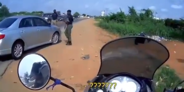 TRENDING: 'What do you bring for us?' Police officer caught seeking bribe from Spanish tourist entering Nigeria on power bike