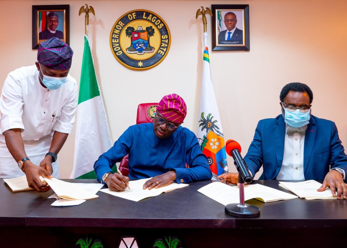 Lagos State Governor, Mr Babajide Sanwo-Olu, signing bills upgrading the Lagos State Polytechnic (LASPOTECH), Adeniran Ogunsanya College of Education (AOCOED) and Michael Otedola College of Primary Education (MOCPED) to universities, flanked by his Special Adviser on Education, Mr Tokunbo Wahab (left) and the Attorney-General/Commissioner for Justice, Mr Moyosore Onigbanjo, SAN, at the Lagos House, Marina, on Wednesday, Feb. 2.