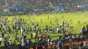 Deaths as fans storm pitch during football game