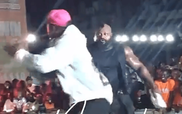 Netizens react to video showing Kizz Daniel’s bodyguard fling excited fan off stage